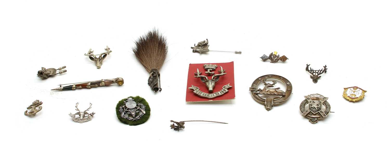 Lot 69 - Ten various metal brooches and cap badges