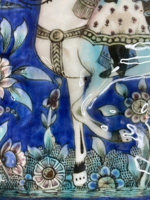 Lot 947 - A near pair of Qajar pottery tiles