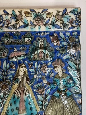 Lot 947 - A near pair of Qajar pottery tiles