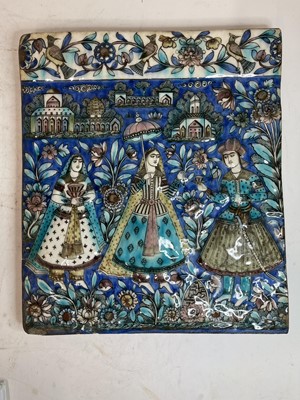 Lot 947 - A near pair of Qajar pottery tiles