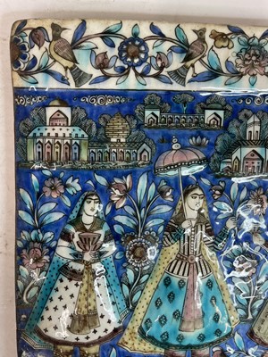 Lot 947 - A near pair of Qajar pottery tiles