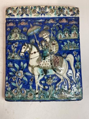 Lot 947 - A near pair of Qajar pottery tiles