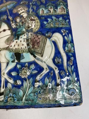 Lot 947 - A near pair of Qajar pottery tiles