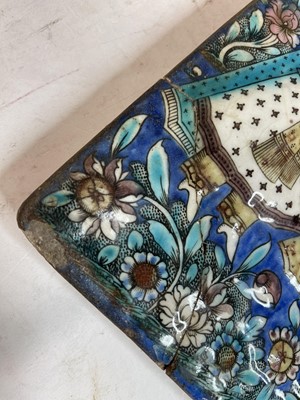 Lot 947 - A near pair of Qajar pottery tiles