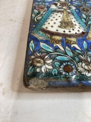 Lot 947 - A near pair of Qajar pottery tiles