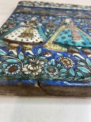 Lot 947 - A near pair of Qajar pottery tiles