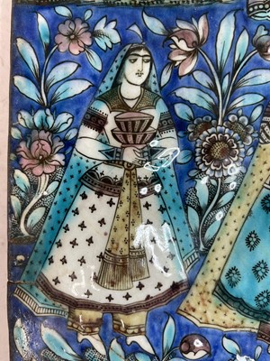 Lot 947 - A near pair of Qajar pottery tiles