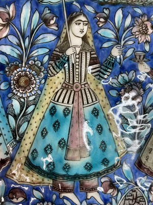 Lot 947 - A near pair of Qajar pottery tiles