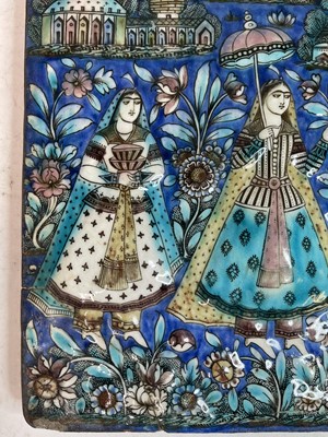 Lot 947 - A near pair of Qajar pottery tiles