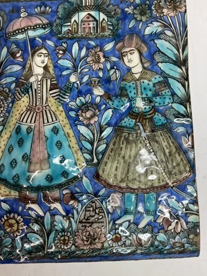 Lot 947 - A near pair of Qajar pottery tiles