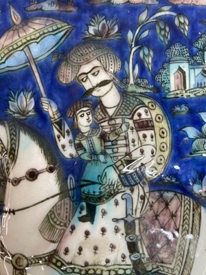 Lot 947 - A near pair of Qajar pottery tiles