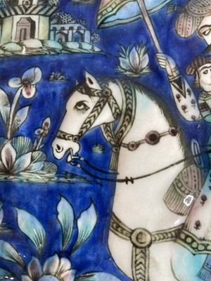 Lot 947 - A near pair of Qajar pottery tiles