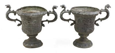 Lot 396 - A pair of twin-handled lead urns