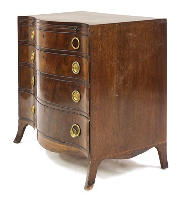 Lot 780 - A George III Cuban mahogany serpentine chest of drawers