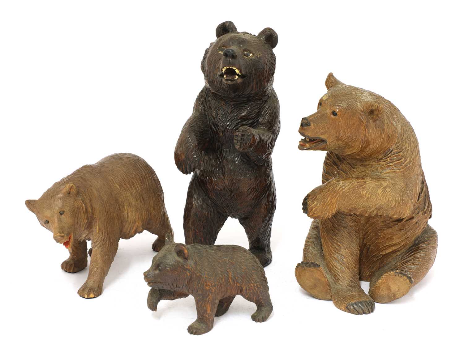 Four carved wooden Black Forest bears | Barnebys