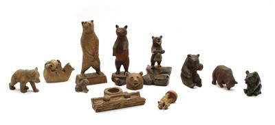Lot 59 - A collection of eleven carved wooden Black Forest and other bears