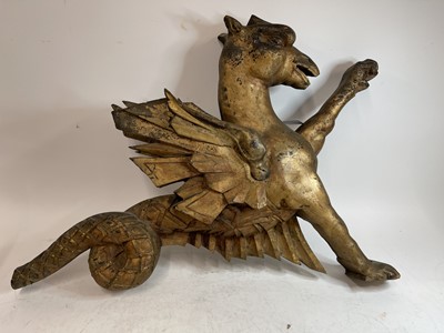 Lot 369 - An opposing pair of carved giltwood dragon finials