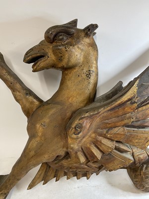 Lot 369 - An opposing pair of carved giltwood dragon finials