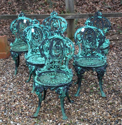 Lot 338 - A set of six Coalbrookdale design cast iron garden chairs