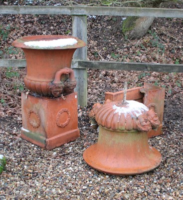 Lot 333 - A pair of terracotta coloured stone urns of Campana form