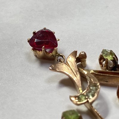 Lot 25 - A Russian gold demantoid garnet and synthetic ruby pendant