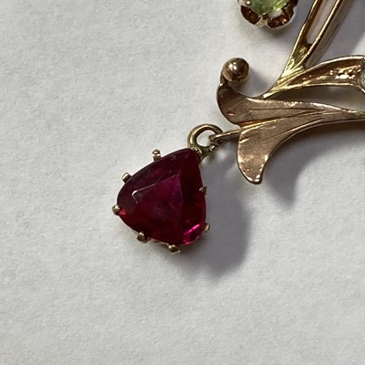 Lot 25 - A Russian gold demantoid garnet and synthetic ruby pendant