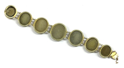 Lot 11 - A gilt metal lava stone cameo bracelet