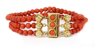 Lot 40 - A three row uniform coral bead bracelet