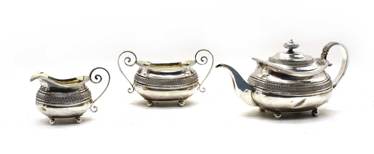 Lot 6 - A  Regency silver three piece tea service by Samuel Hennell, London