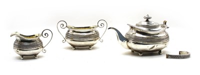 Lot 6 - A  Regency silver three piece tea service by Samuel Hennell, London