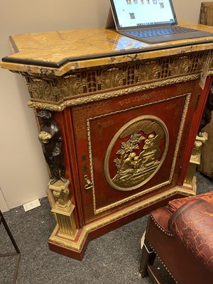 Lot 167 - A red-lacquered and ormolu-mounted pier cabinet