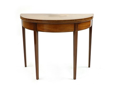 Lot 289 - A George III mahogany and boxwood strung demi lune tea table