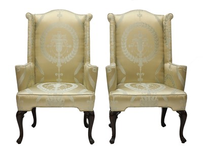 Lot 112 - A pair of wingback armchairs