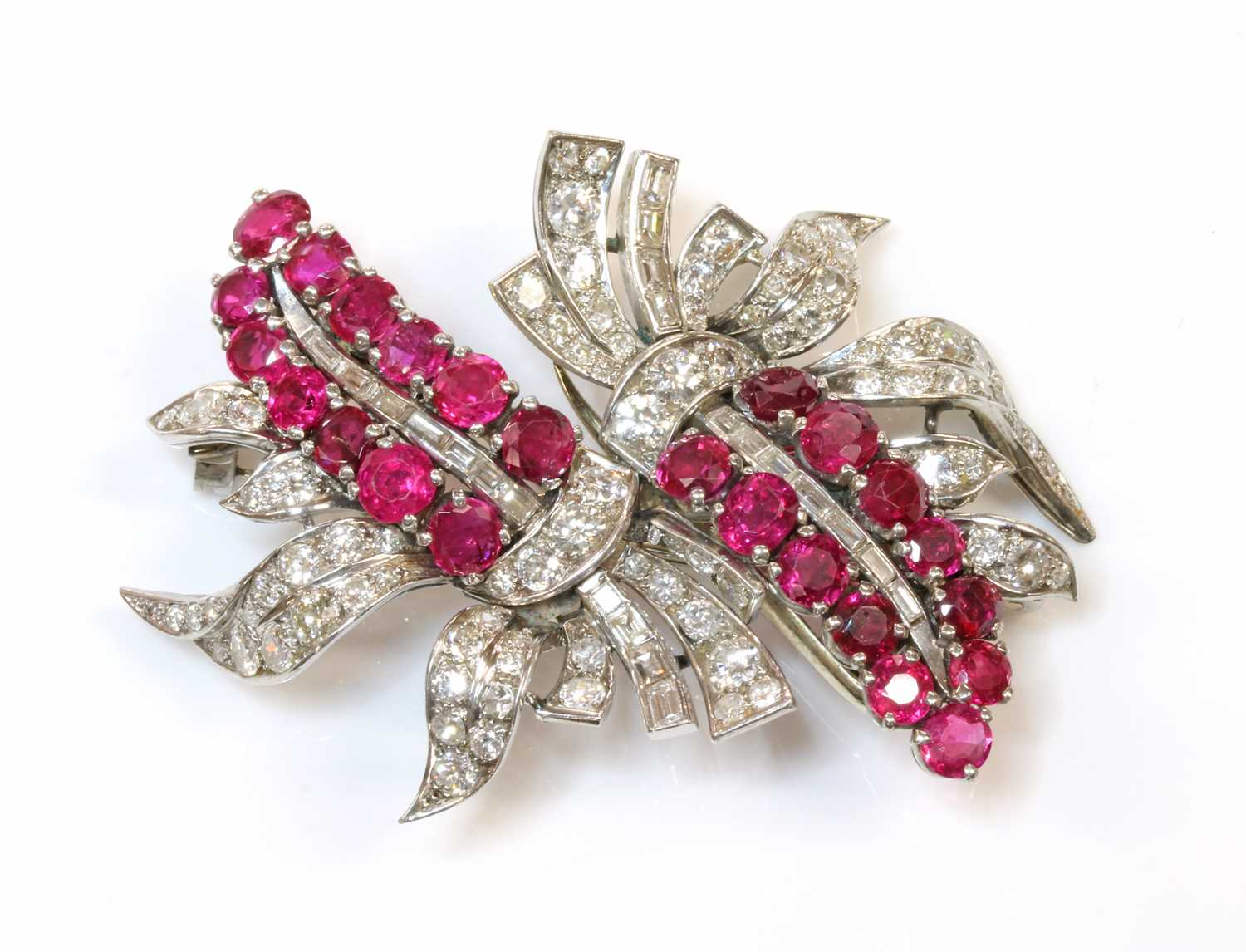 Lot 174 - A ruby and diamond double clip brooch, c.1935-1940