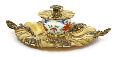 Lot 913 - A Japanese Kakiemon and English Rococo Revival silver-gilt mounted inkstand