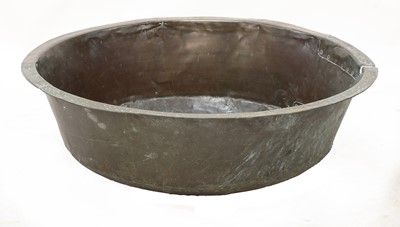 Lot 749 - A riveted and patch repaired round brass bath