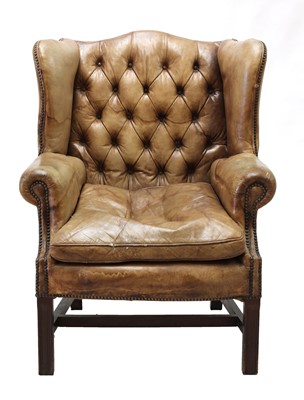 Lot 341 - A George III-style buttoned leather wingback armchair