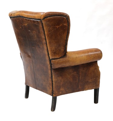 Lot 544 - A George III-style leather wingback armchair