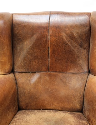 Lot 544 - A George III-style leather wingback armchair