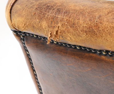 Lot 544 - A George III-style leather wingback armchair