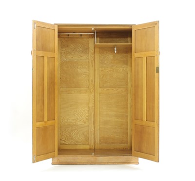 Lot 280 - A Heals style limed oak wardrobe