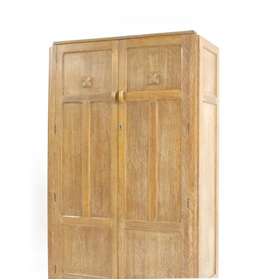 Lot 280 - A Heals style limed oak wardrobe