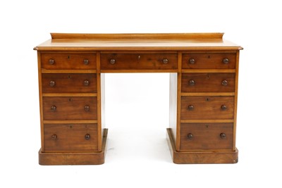 Lot 284 - A Victorian walnut pedestal desk