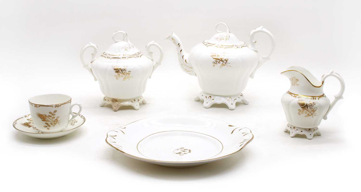 Lot 84 - A 19th century gilt and white tea set