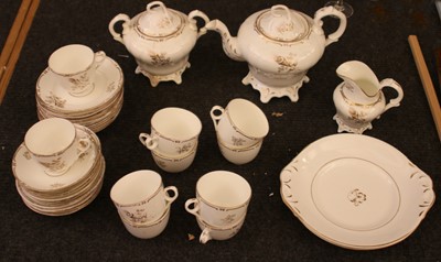 Lot 84 - A 19th century gilt and white tea set
