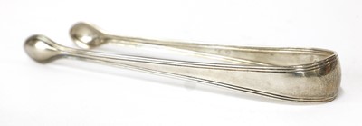 Lot 822 - A pair of George III silver sugar tongs