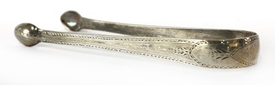 Lot 828 - A pair of William IV Scottish silver King's pattern sugar tongs