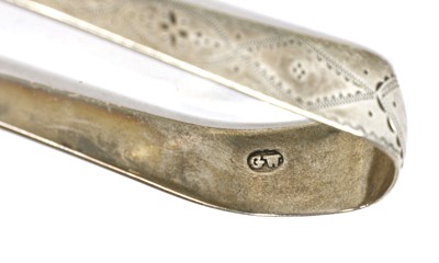 Lot 825 - A pair of George III silver sugar tongs