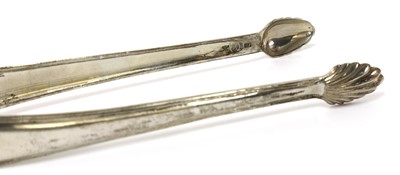 Lot 820 - A pair of George III silver thread pattern sugar tongs