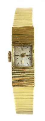 Lot 476 - A ladies' 18ct gold mechanical bracelet watch, c.1960